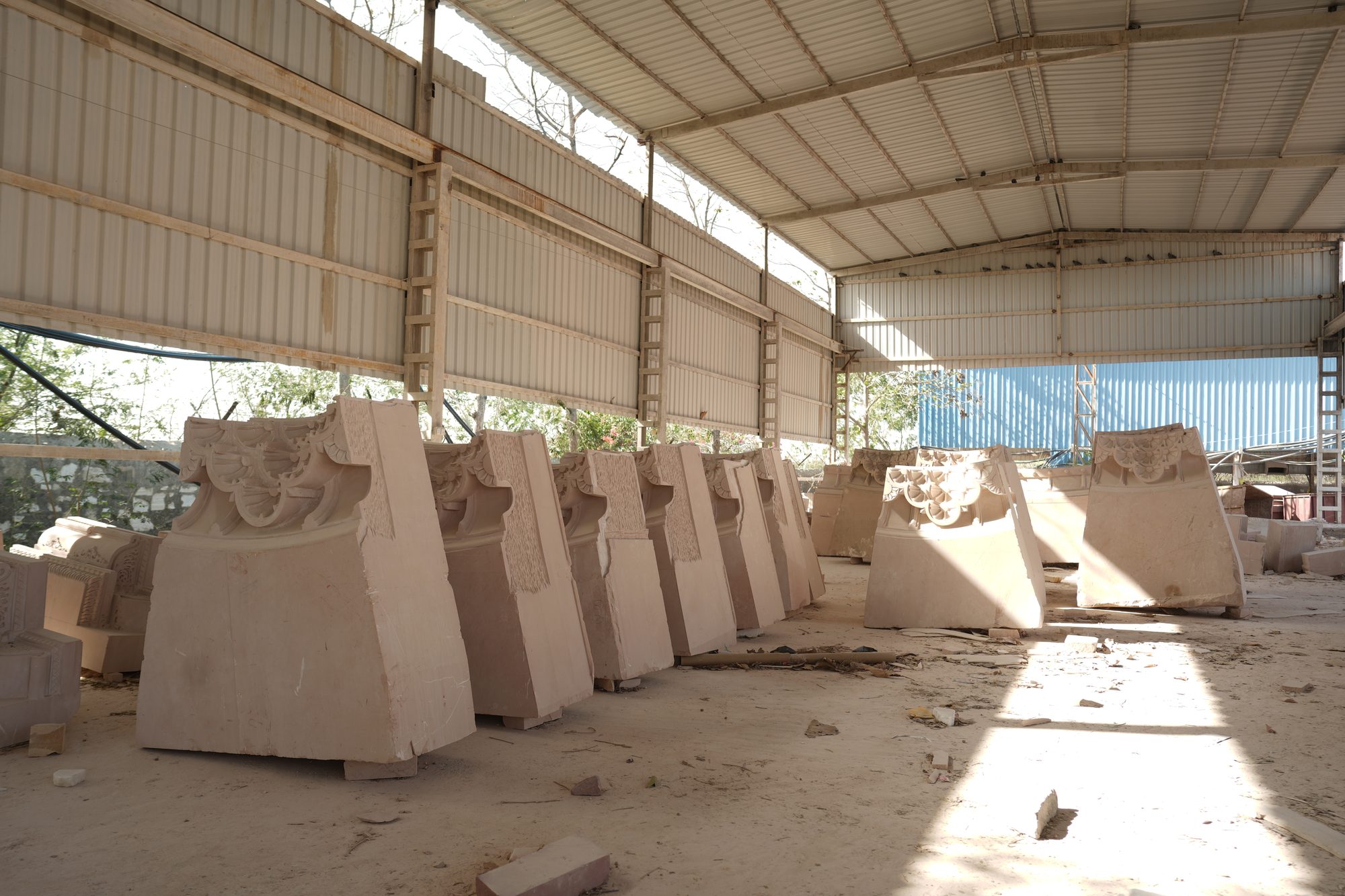 Rows of finished stone pieces staged in the MTCPL dispatch shed