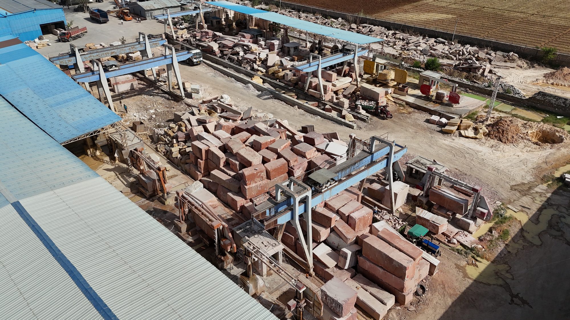 Stone blocks catalogued and stored beneath the gantry cranes